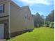 Exterior view showing the side of home with an air conditioner and verdant lawn at 200 Parker Dr, Mcdonough, GA 30253