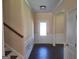 The home's entryway features dark wood floors and classic white wainscoting at 200 Parker Dr, Mcdonough, GA 30253