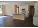 Open-concept kitchen features stainless steel appliances, a large island, and bright lighting at 200 Parker Dr, Mcdonough, GA 30253