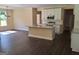 Open-concept kitchen with stainless steel appliances and an island provides plenty of counter space at 200 Parker Dr, Mcdonough, GA 30253
