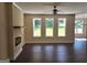 Spacious living room with a modern fireplace, ceiling fan, and lots of natural light at 200 Parker Dr, Mcdonough, GA 30253