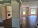 Open-concept living room with dark hardwood floors and neutral paint colors offers lots of natural light at 200 Parker Dr, Mcdonough, GA 30253