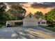 Two-story house with carport and sunset view at 2785 Amberly Hills Trl, Dacula, GA 30019