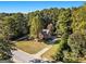 Aerial view of home nestled in a wooded area at 1241 Lambeth Se Way, Conyers, GA 30013