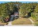 Aerial view of a house with a large backyard surrounded by trees at 1241 Lambeth Se Way, Conyers, GA 30013