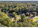 Expansive aerial view showcasing the home's wooded setting at 1241 Lambeth Se Way, Conyers, GA 30013