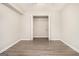 Basement bedroom with grey vinyl plank flooring and closet at 1241 Lambeth Se Way, Conyers, GA 30013