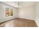 Well-lit bedroom with hardwood floors and a large window at 1241 Lambeth Se Way, Conyers, GA 30013