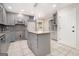 Modern kitchen with gray cabinets, granite countertops and island at 1241 Lambeth Se Way, Conyers, GA 30013