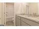 Bathroom showcasing double vanity with granite counters and bathtub/shower combo at 359 Orwell Dr # 53, Social Circle, GA 30025