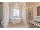 Bright bathroom featuring a soaking tub, walk-in shower, and granite countertop at 359 Orwell Dr # 53, Social Circle, GA 30025