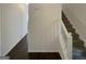Bright foyer featuring hardwood floors, a staircase, and fresh neutral paint leading to other areas of the home at 200 Eagle Glen Ct, Woodstock, GA 30189