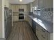 Well-lit kitchen featuring stainless appliances, granite countertops, and a tiled backsplash at 200 Eagle Glen Ct, Woodstock, GA 30189