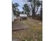 Backyard with shed and small concrete patio at 9388 Crest Knoll Ct, Jonesboro, GA 30238