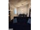 Dining area with chandelier and view into kitchen at 9388 Crest Knoll Ct, Jonesboro, GA 30238