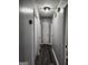 Simple hallway with gray walls and wood-look flooring at 9388 Crest Knoll Ct, Jonesboro, GA 30238