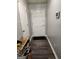 Clean hallway with gray walls and wood-look flooring at 9388 Crest Knoll Ct, Jonesboro, GA 30238