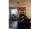 Living room featuring a stone fireplace and comfy couch at 9388 Crest Knoll Ct, Jonesboro, GA 30238