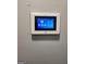 ADT security system panel installed on the wall at 9388 Crest Knoll Ct, Jonesboro, GA 30238
