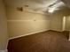 Large basement bedroom with neutral walls, carpet, and ceiling fan at 1009 Longley Nw Ave, Atlanta, GA 30318