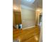 Upstairs hallway with hardwood floors and access to bedrooms at 1009 Longley Nw Ave, Atlanta, GA 30318