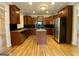 Kitchen boasts granite counters, dark wood cabinets, and an island at 1009 Longley Nw Ave, Atlanta, GA 30318