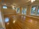 Spacious living room with hardwood floors, fireplace and multiple windows at 1009 Longley Nw Ave, Atlanta, GA 30318