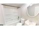 Clean bathroom with a bathtub, toilet, and vanity at 1092 W Adrian Sw Cir, Conyers, GA 30094