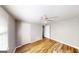 Bedroom with wood-look floors, ceiling fan and window at 1092 W Adrian Sw Cir, Conyers, GA 30094