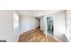 Bedroom with wood-look floors, closet and bathroom access at 1092 W Adrian Sw Cir, Conyers, GA 30094