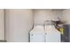 Laundry room with washer, dryer, and shelving at 1092 W Adrian Sw Cir, Conyers, GA 30094