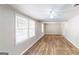 Bright living room with hardwood floors and neutral walls at 1092 W Adrian Sw Cir, Conyers, GA 30094