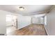Open concept living area with hardwood floors and kitchen access at 1092 W Adrian Sw Cir, Conyers, GA 30094