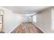 Open concept living area with hardwood floors and kitchen access at 1092 W Adrian Sw Cir, Conyers, GA 30094