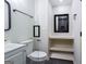 Updated bathroom features modern vanity, toilet, and shower with glass partition and stylish fixtures at 504 Milligan Dr, Stone Mountain, GA 30083