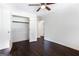 Bedroom with hardwood floors features ample closet space and access to ensuite bathroom at 504 Milligan Dr, Stone Mountain, GA 30083