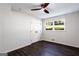 Bedroom with hardwood floors, a ceiling fan, a window and a closet with white doors at 504 Milligan Dr, Stone Mountain, GA 30083