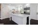 Modern kitchen featuring white cabinets, stainless steel appliances, a quartz countertop island at 504 Milligan Dr, Stone Mountain, GA 30083