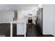 Renovated kitchen with stainless steel appliances, white cabinets, and quartz countertops at 504 Milligan Dr, Stone Mountain, GA 30083