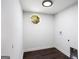 Laundry room with window and new hardwood floor and grey walls at 504 Milligan Dr, Stone Mountain, GA 30083