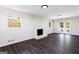 Spacious living room with white brick fireplace, backyard access, and hardwood floors at 504 Milligan Dr, Stone Mountain, GA 30083