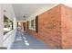 Covered porch with brick exterior, providing a welcoming entrance and outdoor living space at 504 Milligan Dr, Stone Mountain, GA 30083