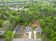 Aerial view of new construction with white exterior and concrete driveway in a wooded area at 241 Ben Horton Dr, Mcdonough, GA 30253
