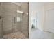 Contemporary bathroom features glass shower with modern fixtures, tile and open access to soaking tub at 241 Ben Horton Dr, Mcdonough, GA 30253