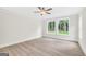 Bright bedroom with three windows and a ceiling fan at 241 Ben Horton Dr, Mcdonough, GA 30253