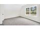 Cozy bedroom with neutral carpet, natural light from large window and exterior views at 241 Ben Horton Dr, Mcdonough, GA 30253