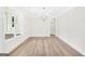 Bright dining room with natural light, wood floors, and modern chandelier at 241 Ben Horton Dr, Mcdonough, GA 30253