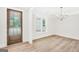 Bright dining room with natural light, wood floors, and modern chandelier at 241 Ben Horton Dr, Mcdonough, GA 30253