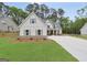 Elegant home with white siding, symmetrical windows, and a well-maintained front yard at 241 Ben Horton Dr, Mcdonough, GA 30253