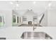 Open concept kitchen featuring quartz countertops, stainless steel appliances, and a view into the living room at 241 Ben Horton Dr, Mcdonough, GA 30253